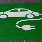 electric vehicle market road sign